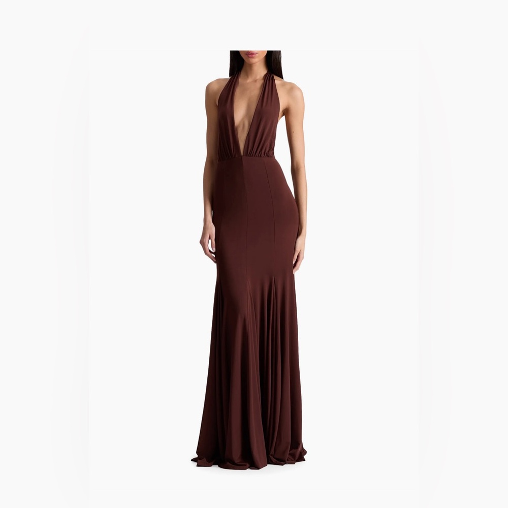 Alice + Olivia V-halterneck, an open back, and an A-line silhouette.
